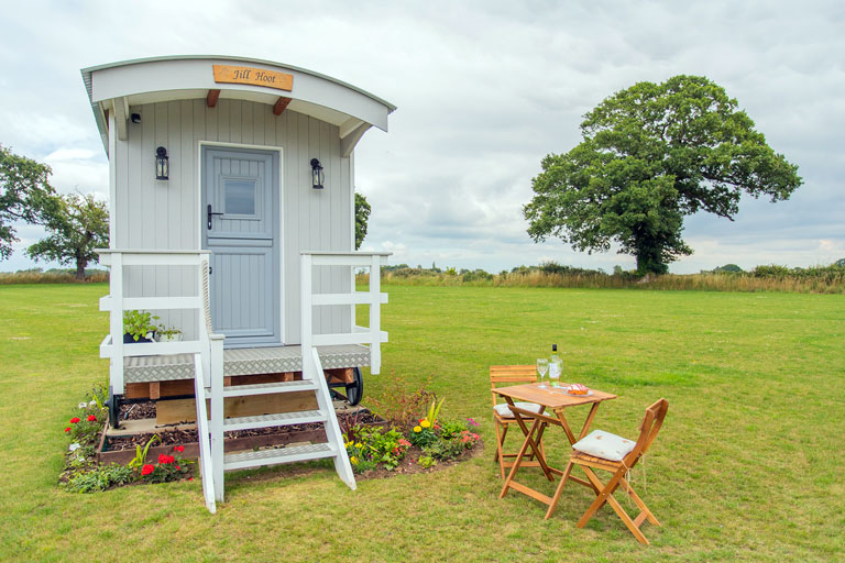 Each hut comes with a folding picnic table and two chairs
